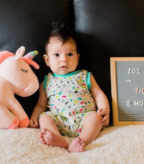 A baby in a bright romper