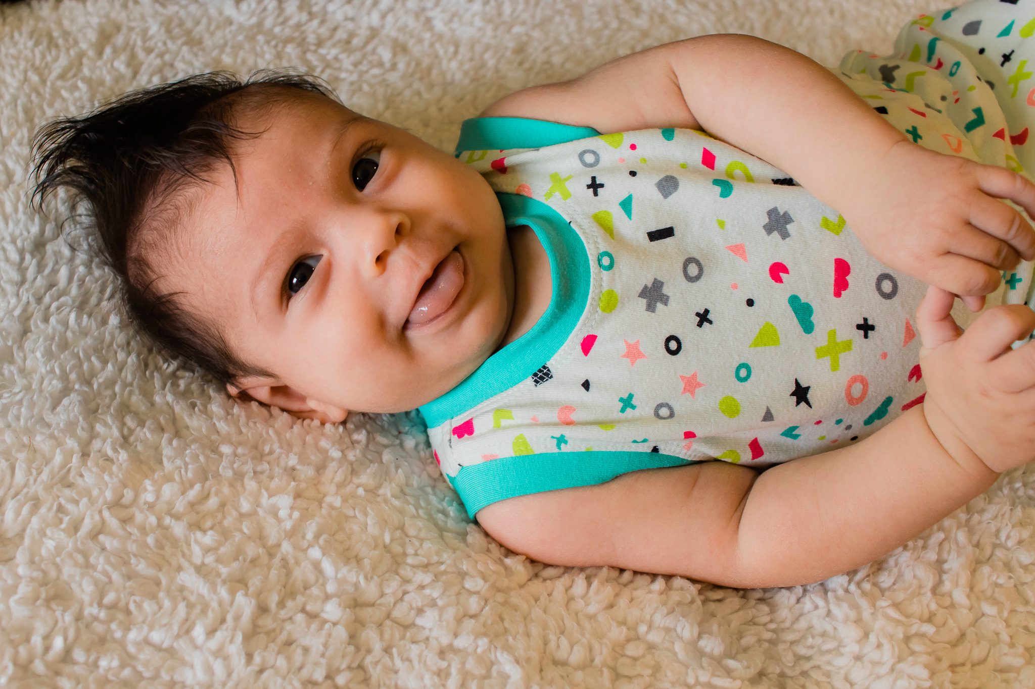 A baby in a bright romper
