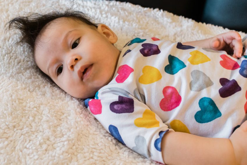 4 month old in colorful heart dress